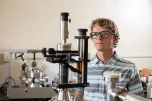 student looks at physics materials