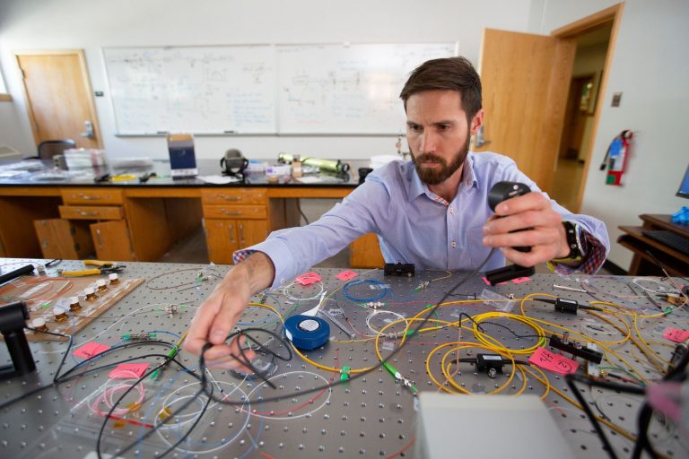 Professor Behunin works at his research table